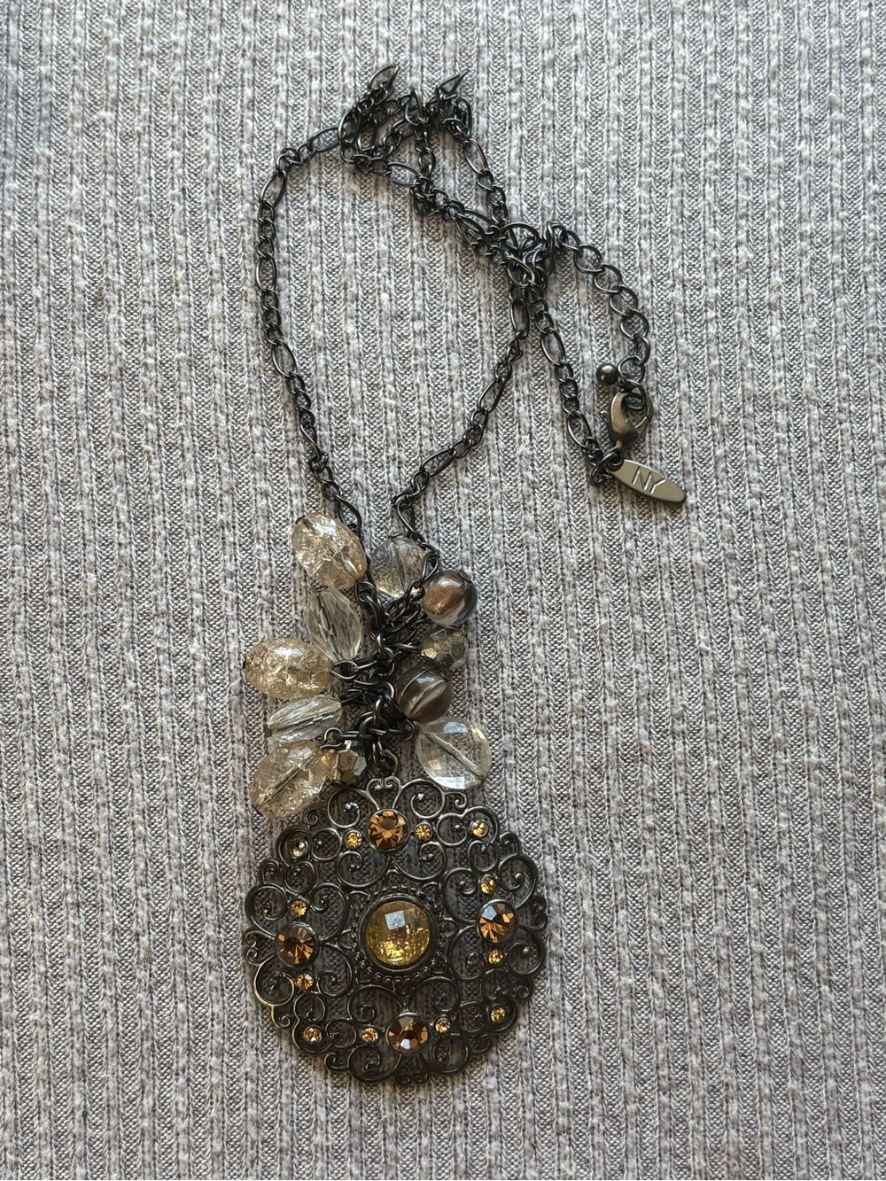 Vintage NY signed dark metal round pendant adjustable necklace w rhinestones